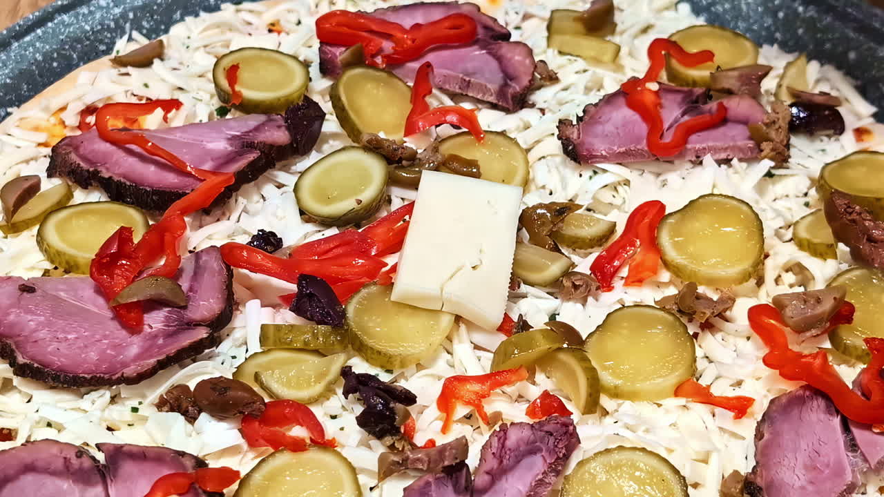 Homemade pizza food, adding toppings mixed meat vegetable mozzarella italian dish