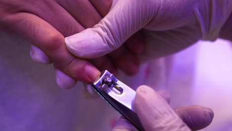 cutting nails on hand with a nail clipper