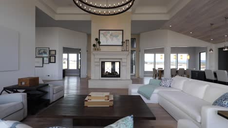 contemporary living room and interior of bright, white, open floor plan luxury home.
