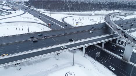 aerial view of a freeway intersection snow-covered in winter.