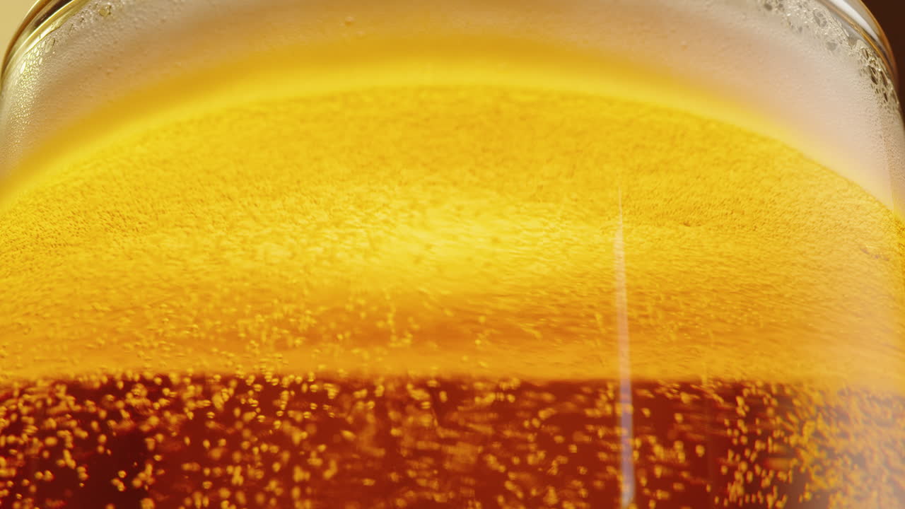 Close-up of a glass of beer with bubbles