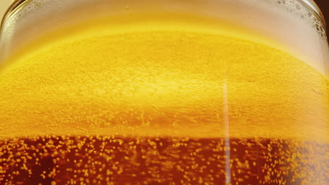 close-up of a glass of beer with bubbles