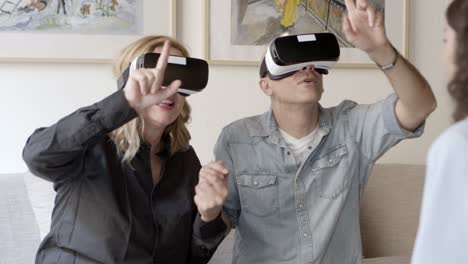 front view of excited mature people experiencing vr glasses