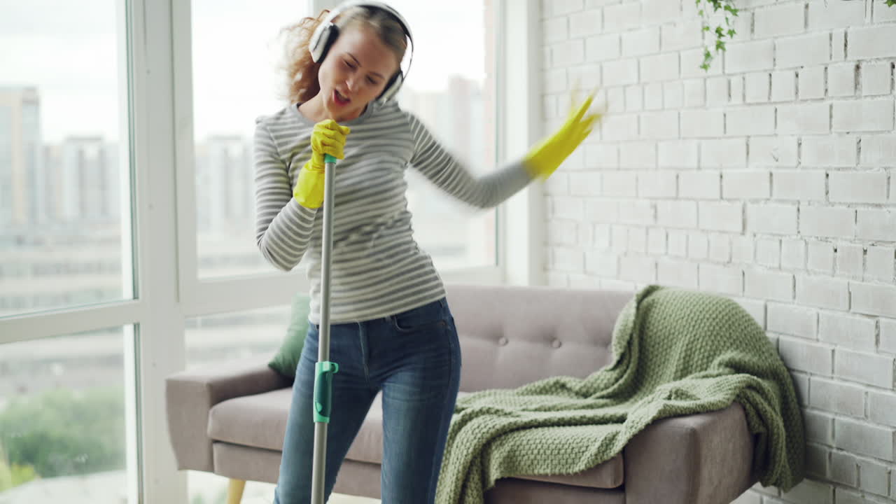 Woman Cleaning and Singing