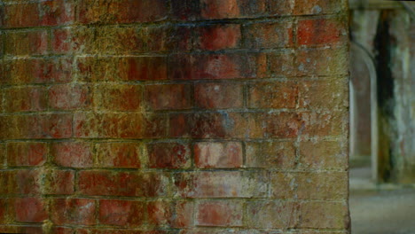 looking through under a brick bridge beautiful smooth sideways shot in kyoto, japan soft lighting