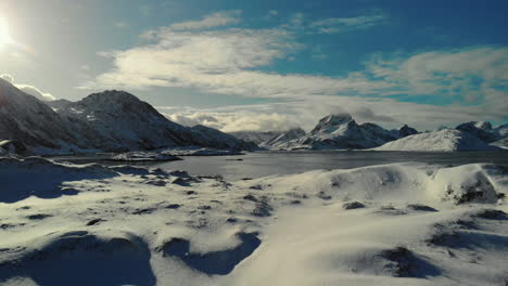 Clod-shave-drone-shot-of-mountains-and-lake-in-winter