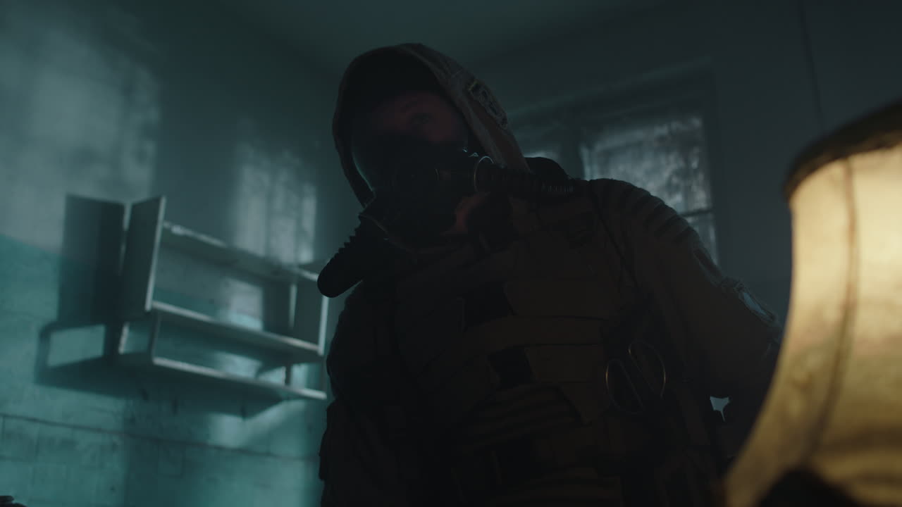 Person in Protective Gear in Abandoned Room