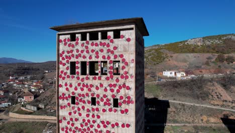 Destroyed-factory-tower-used-for-art,-painted-with-Leddy-bugs-in-Albania