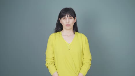 woman looking depressed at camera.