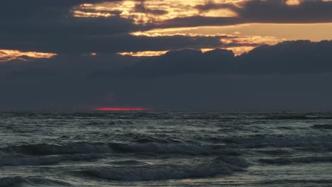 twilight glows on owen sound, waves churn under cloudy skies