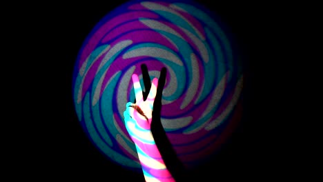 the human hand showing victory sign on background of colorful tunnel flythrough loop