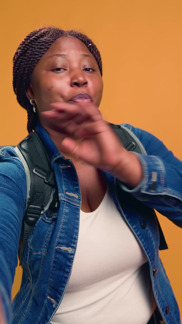Portrait of an African American woman wearing a backpack