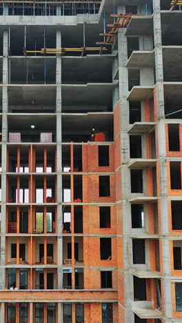 construction of a residential apartment complex. aerial view. vertical video