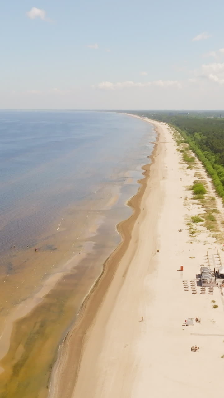 Aerial view rotating over the Jurmala beach, sunny, summer day in Latvia