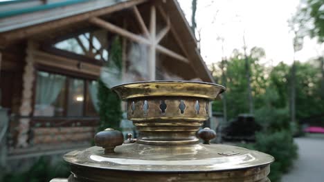 ancient russian samovar. traditional russian tea with samovar in the garden, summer day