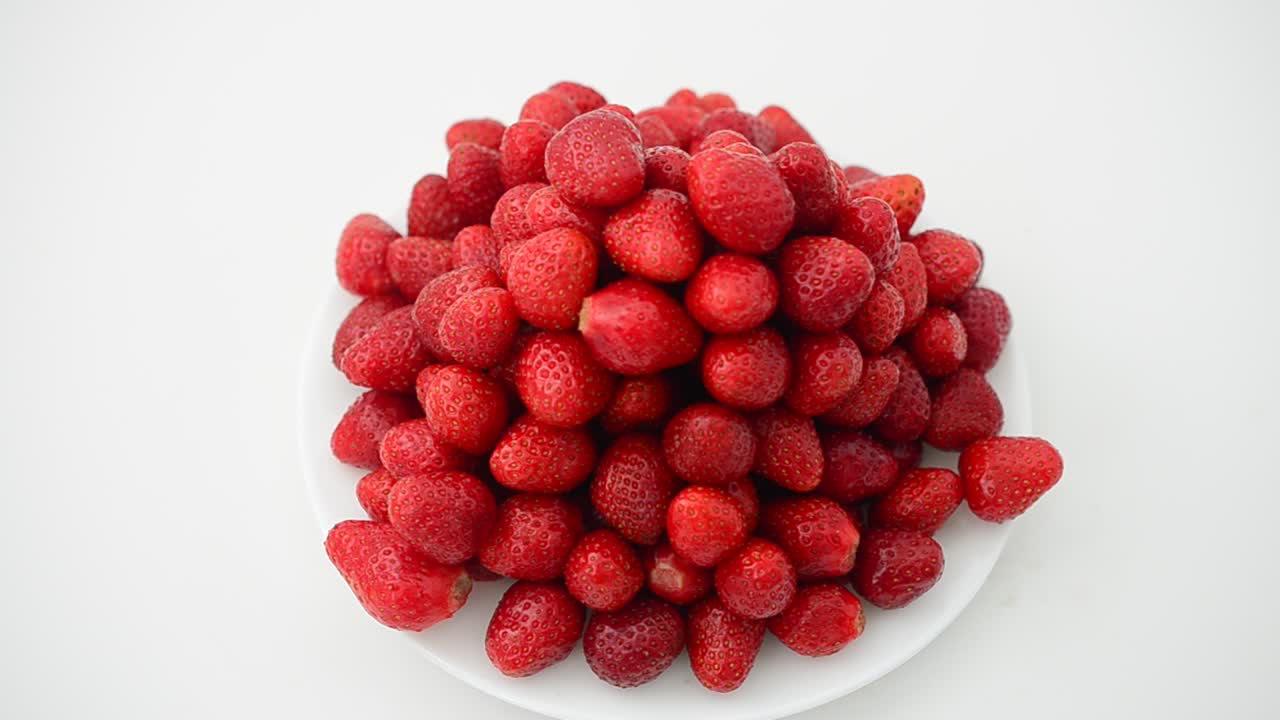 Strawberry on a white background, isolate. Shooting in the movement