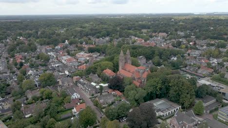 beautiful aerial of small dutch town with a large church in the town center