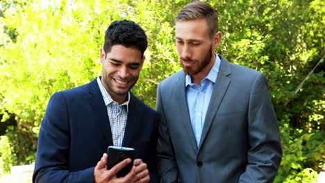 businessmen discussing over mobile phone 4k