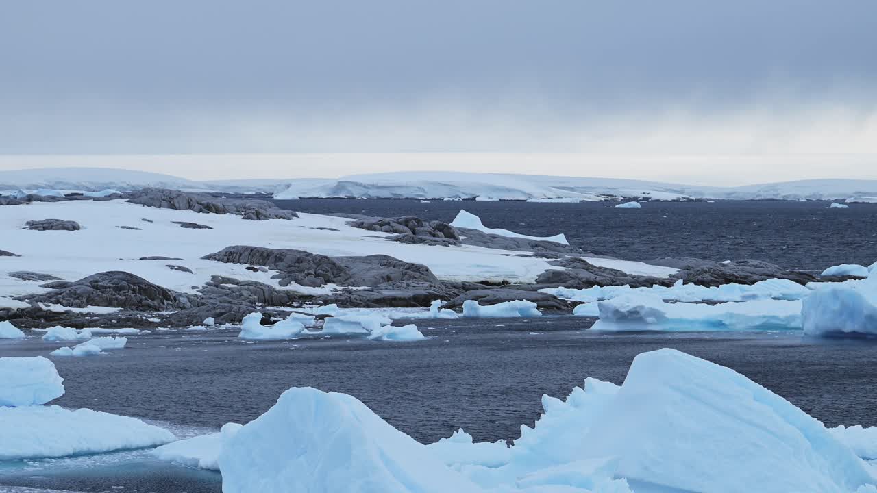 Antarctica Winter Land and Coast at Sunset, Ocean with Dramatic Clouds and Sky, Amazing Scenery on Antarctic Peninsula Coast, Sunset Coastal Scenery in Icy Snowy Scene in Cold Weather