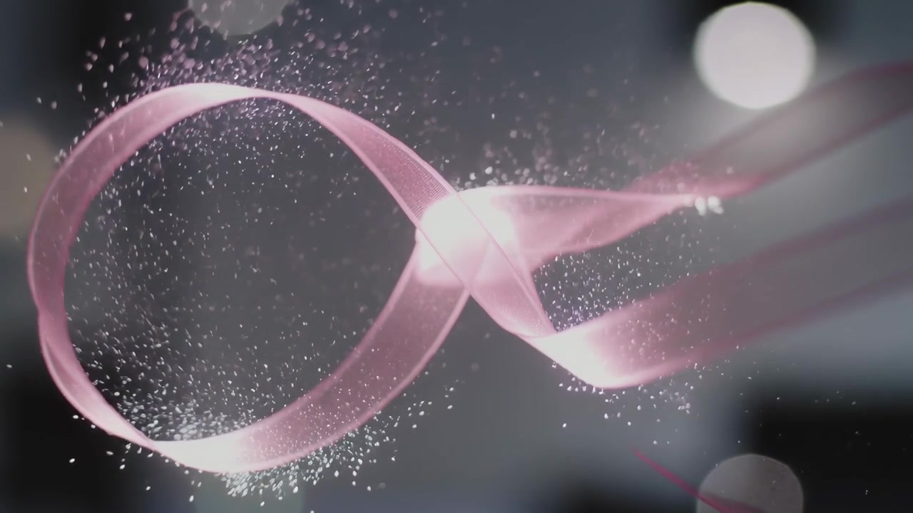 Entering from right pink ribbon knotting over bokeh set, creating shimmer and emitting particles