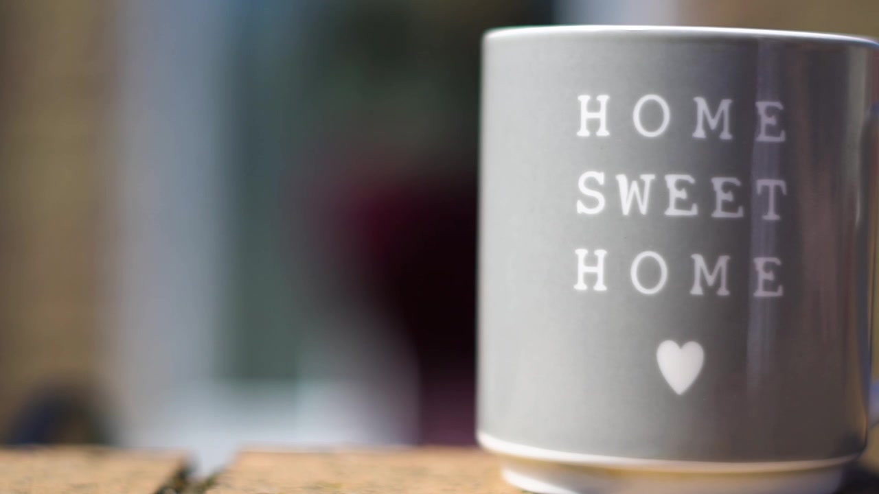 Women walks away and leaves her cup.