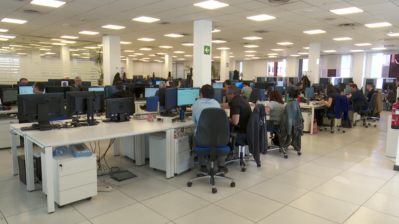 Busy office workspace with employees working