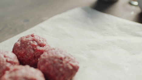 putting meatballs on baking paper