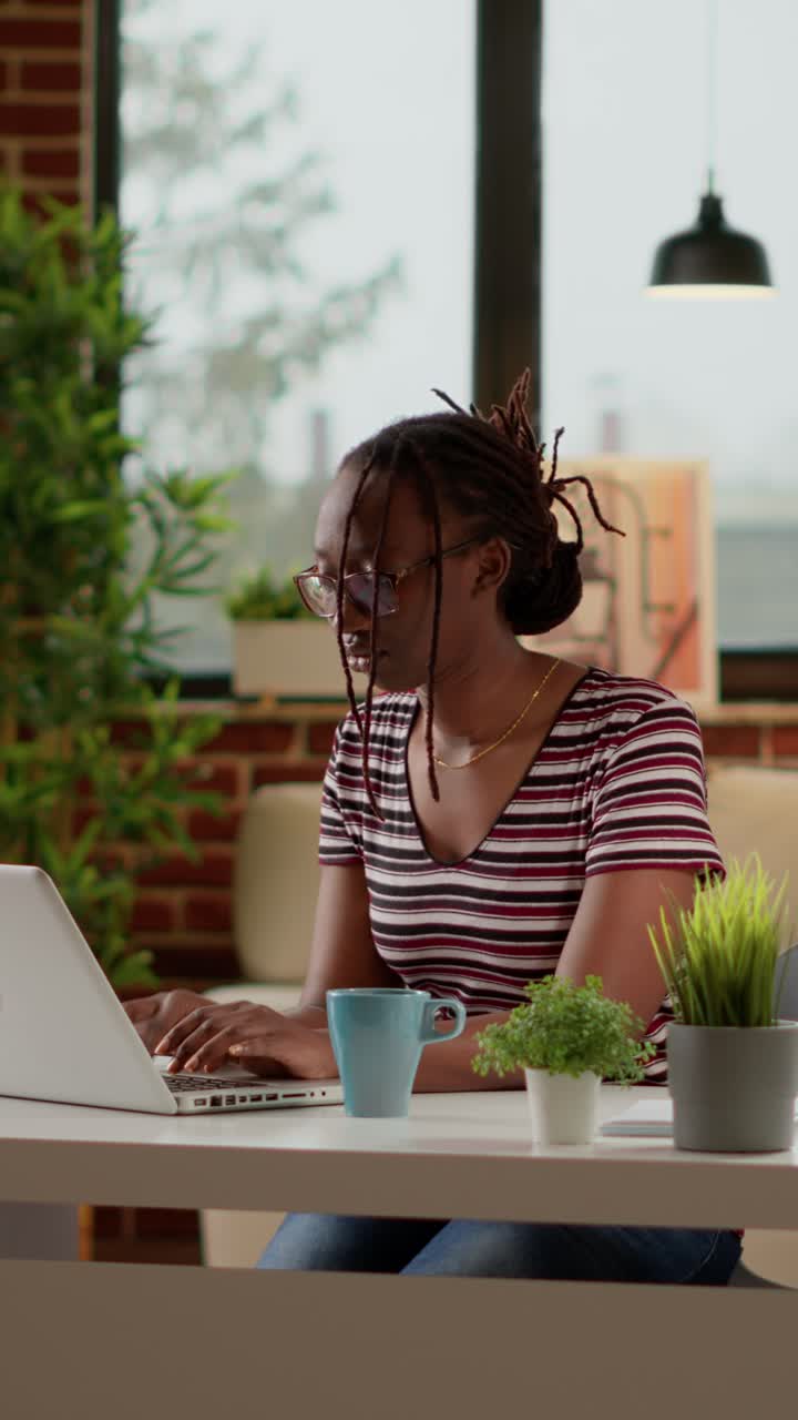 Woman working on a laptop indoors