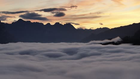 sunset over a sea of clouds in the mountains