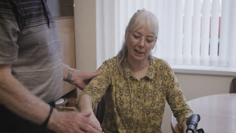 elderly couple with caregiver support