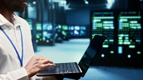 Developer walking through mainframe rows