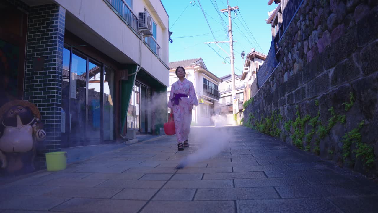 Japanese Girl Walking Through Onsen Steam in Beppu, Oita Japan