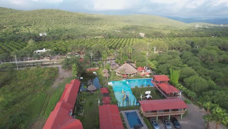 aerial view of a hotel with a swimming pool