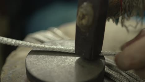 jeweler at work in jewelry. desktop for craft jewelry making with professional tools. close up view of tools. thailand.