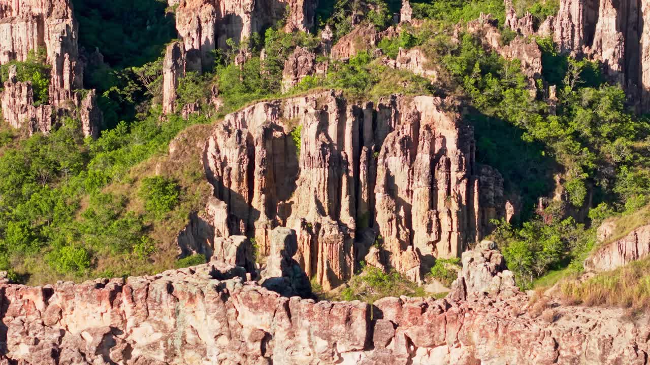 Aerial backward shot showing the eroded columns and pedestals of los estoraques in norte de santander