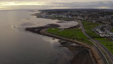 Celia-Griffin-memorial-park-with-Connemara-in-distance,-Claddagh-Ireland