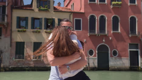 couple hugging in venice, italy