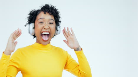 happy, dance and woman with headphones on a white