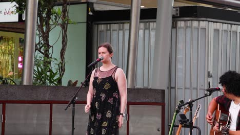 two musicians performing together outdoors