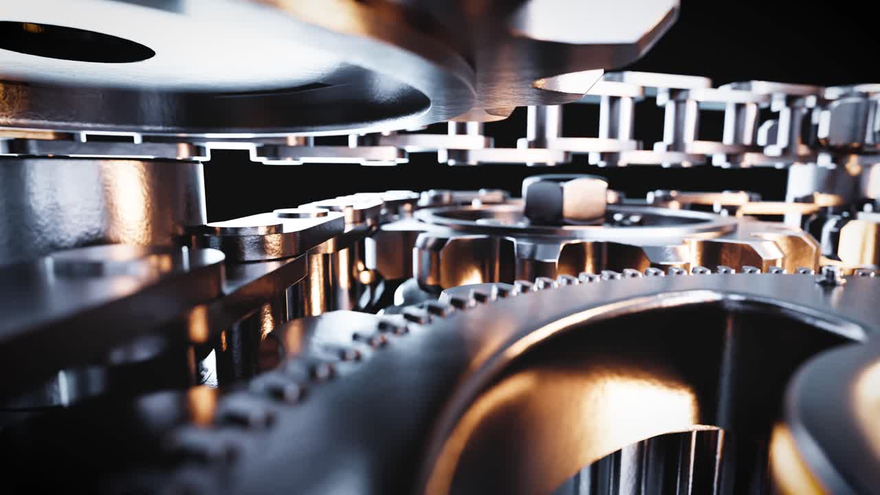 Close-up of Intricate Metal Gears and Chain Rotating Smoothly
