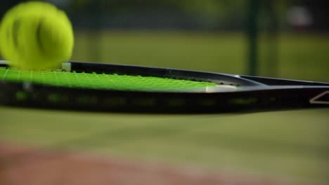 close up of tennis player hitting the ball several times sunny day