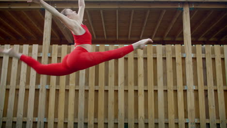 woman doing acrobatic exercises outdoors
