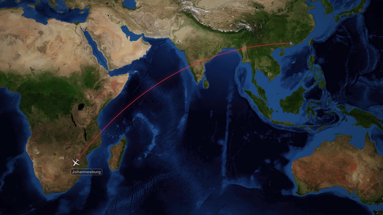 Satellite world map animation tracks an airplane flying from Guangzhou to Johannesburg over oceans