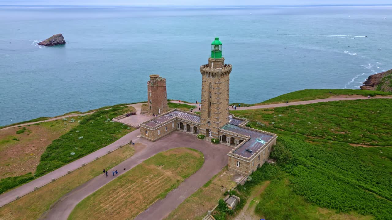 Smooth approaching drone movement to the Cap Fréhel peninsula monument lighthouse, Côtes-d'Armor, Brittany, France.