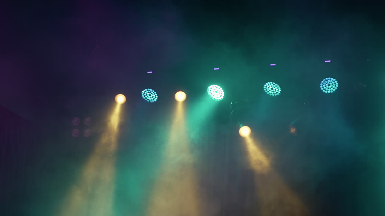 Colorful Stage Lights Shining Through Smoke