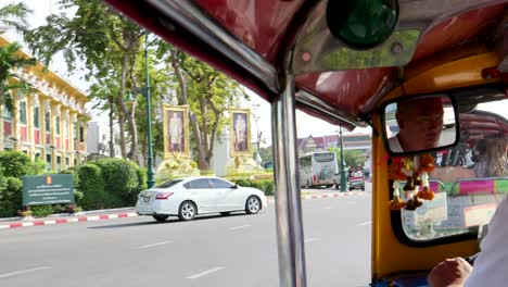 passenger's view during a tuk-tuk journey in traffic