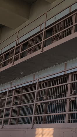 vertical view, alcatraz prison cellhouse, closed prison cells on gallery in block c, low angle. california usa