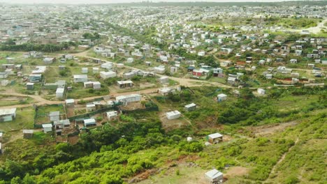 drone aerial of a huge informal settlement at a coastal town in south africa