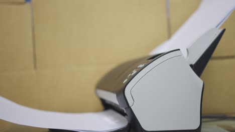 close-up scanner machine is scanning documents to convert paper to information data digital into computer.