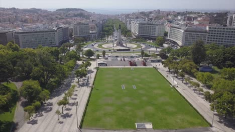 sunny day lisbon city marquess of pombal square aerial park panorama 4k portugal